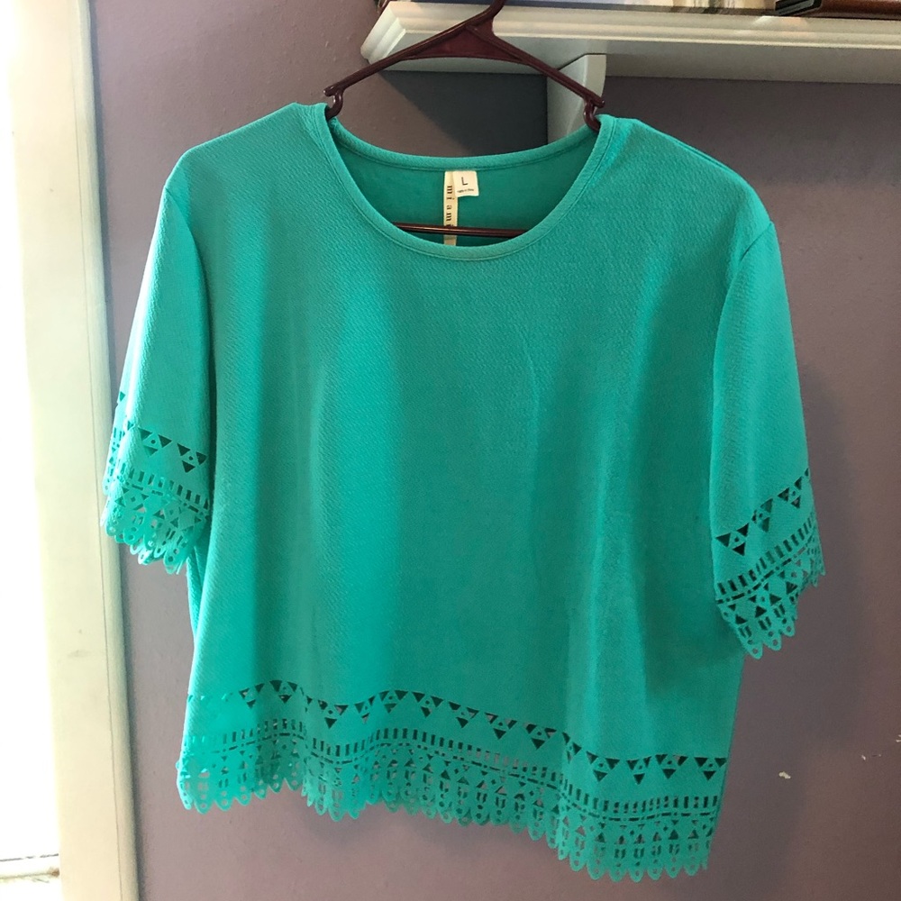 Teal green cropped shirt w/ cut out detailing
